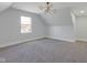 Spacious carpeted bedroom with plenty of natural light from a large window at 2312 Fletcher St, Anderson, IN 46016