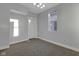 Neutral bedroom offers natural light and neutral carpeting at 2312 Fletcher St, Anderson, IN 46016