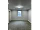 Spacious bedroom with natural light and neutral carpeting at 2312 Fletcher St, Anderson, IN 46016