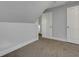 Carpeted bedroom features neutral walls and bright white trim and doors at 2312 Fletcher St, Anderson, IN 46016