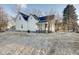 Charming two-story home features a clean white facade and welcoming front porch at 2312 Fletcher St, Anderson, IN 46016