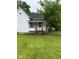 Charming home featuring a covered front entrance and green lawn at 2312 Fletcher St, Anderson, IN 46016