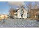 Charming renovated home featuring a well-maintained lawn and classic white siding at 2312 Fletcher St, Anderson, IN 46016