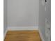 Clean, bright hallway with wood floors and white trim at 2312 Fletcher St, Anderson, IN 46016