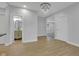 Open-concept interior featuring wood floors and a bathroom at 2312 Fletcher St, Anderson, IN 46016