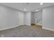Spacious living room featuring plush carpeting and neutral paint, creating a cozy atmosphere at 2312 Fletcher St, Anderson, IN 46016