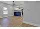 Open-concept living area with a large window and wood floors at 2312 Fletcher St, Anderson, IN 46016