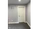 Clean room featuring neutral carpeting and a white door at 2312 Fletcher St, Anderson, IN 46016