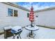 Backyard featuring outdoor furniture and a grill, perfect for outdoor entertaining, covered in snow at 26 Highland Ave, Franklin, IN 46131