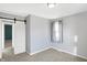 Neutral bedroom with a sliding closet door and a bright window at 26 Highland Ave, Franklin, IN 46131