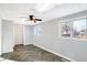 Bright bedroom featuring herringbone floors, large windows, and fresh paint at 26 Highland Ave, Franklin, IN 46131