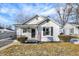 Charming bungalow-style home with white siding, black shutters, and a cozy front porch at 26 Highland Ave, Franklin, IN 46131