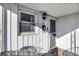 Inviting front porch with seating, decorative lighting, and an attractive front door at 26 Highland Ave, Franklin, IN 46131