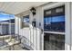 Inviting front porch with seating, decorative lighting, and an attractive front door at 26 Highland Ave, Franklin, IN 46131
