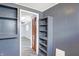 Hallway with herringbone floors, built-in shelving, and open doorway to another room at 26 Highland Ave, Franklin, IN 46131
