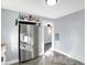 Spacious kitchen with stainless steel refrigerator and stylish herringbone flooring at 26 Highland Ave, Franklin, IN 46131