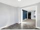 Open living area featuring herringbone flooring and a view to the entryway at 26 Highland Ave, Franklin, IN 46131