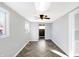 Neutral living room showcasing herringbone floors, a ceiling fan, and plenty of natural light at 26 Highland Ave, Franklin, IN 46131