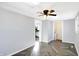Open living area featuring herringbone floors, a ceiling fan, and access to the kitchen at 26 Highland Ave, Franklin, IN 46131