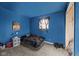 Cozy bedroom featuring colorful walls, soft carpet, and natural light, creating a comfortable retreat at 2610 Caroline Ave, Indianapolis, IN 46218