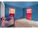 Bright bedroom featuring colorful decor, soft carpet, and natural light, creating a comfortable space at 2610 Caroline Ave, Indianapolis, IN 46218