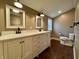 Elegant bathroom featuring a dual sink vanity, marble countertop, and modern fixtures, creating a serene space at 307 S Main St, Whitestown, IN 46075