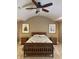 Cozy bedroom with a unique tray ceiling, complemented by nautical-themed art and classic wooden furniture at 307 S Main St, Whitestown, IN 46075