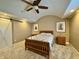 Spacious bedroom with a barn door, sailboat decor, and a comfortable bed with a cozy patterned quilt at 307 S Main St, Whitestown, IN 46075