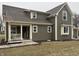 Charming home featuring vertical siding, a covered porch, and well-maintained landscaping at 307 S Main St, Whitestown, IN 46075