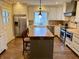 Well-designed kitchen featuring white cabinets, butcher block countertops, and stainless steel appliances at 307 S Main St, Whitestown, IN 46075