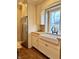 Kitchen featuring stainless steel refrigerator and farmhouse sink with wooden countertops at 307 S Main St, Whitestown, IN 46075