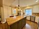 Bright kitchen with white cabinets, stainless steel appliances, and a functional layout at 307 S Main St, Whitestown, IN 46075