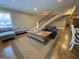 Bright living room featuring a staircase, hardwood floors, and a comfortable seating area at 307 S Main St, Whitestown, IN 46075