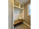 Mudroom bench with hooks and shelves for storage at 307 S Main St, Whitestown, IN 46075