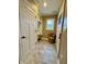 Mudroom showcasing a bench with hooks and a window with a view of outside at 307 S Main St, Whitestown, IN 46075