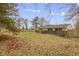 View of spacious backyard with wood fence at 3645 Glencairn Ln, Indianapolis, IN 46205