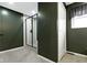 Modern bathroom with a sleek glass-enclosed shower and neutral color palette at 3645 Glencairn Ln, Indianapolis, IN 46205