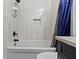 Remodeled bathroom features stylish tile work, a recessed storage nook, and modern fixtures at 3645 Glencairn Ln, Indianapolis, IN 46205