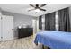 Bedroom with neutral walls, ceiling fan, and wood-look flooring at 3645 Glencairn Ln, Indianapolis, IN 46205