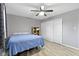 Bedroom with ceiling fan and double door closet at 3645 Glencairn Ln, Indianapolis, IN 46205