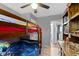 bedroom with bunk beds, ceiling fan, and neutral-toned walls at 3645 Glencairn Ln, Indianapolis, IN 46205