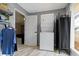 Laundry room features stackable washer/dryer with access to the backyard at 3645 Glencairn Ln, Indianapolis, IN 46205