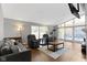 Cozy living room with hardwood floors, fireplace, and vaulted ceilings at 3645 Glencairn Ln, Indianapolis, IN 46205