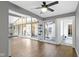 Spacious living room with hardwood floors and large windows allowing for abundant natural light at 3645 Glencairn Ln, Indianapolis, IN 46205