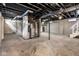 Unfinished basement featuring concrete floors and exposed ceiling at 3708 Rockville Rd, Indianapolis, IN 46222