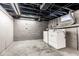 Unfinished basement featuring concrete floors and washer and dryer at 3708 Rockville Rd, Indianapolis, IN 46222