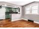 Open kitchen concept featuring updated appliances and bar seating at 3708 Rockville Rd, Indianapolis, IN 46222