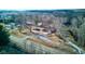 An aerial view of a charming property with a brick house and a detached garage at 4018 S State Road 75, Coatesville, IN 46121
