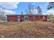 Home backyard featuring patio, mature trees, grass, and privacy fence at 4018 S State Road 75, Coatesville, IN 46121