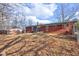 Expansive backyard featuring a well-maintained lawn and a charming brick house at 4018 S State Road 75, Coatesville, IN 46121
